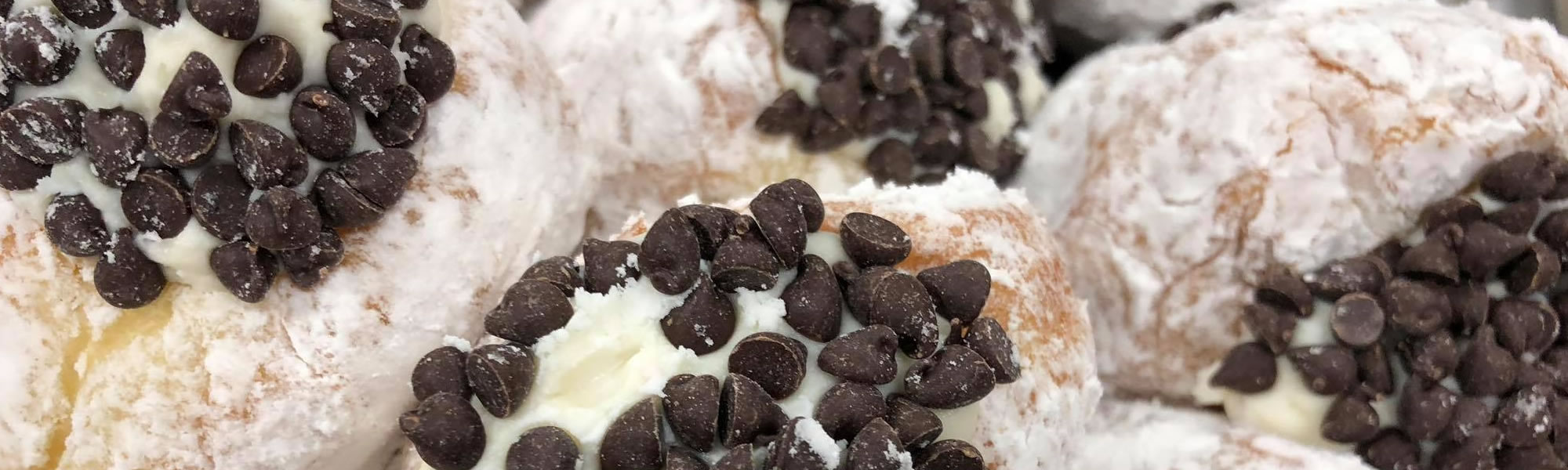 Melt-in-your-mouth baked goods, including this donut canoli sprinkled with chocolate chips, await you at the Hole in One in Eastham and Orleans, MA.