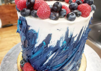 raspberry and blueberry covered cake