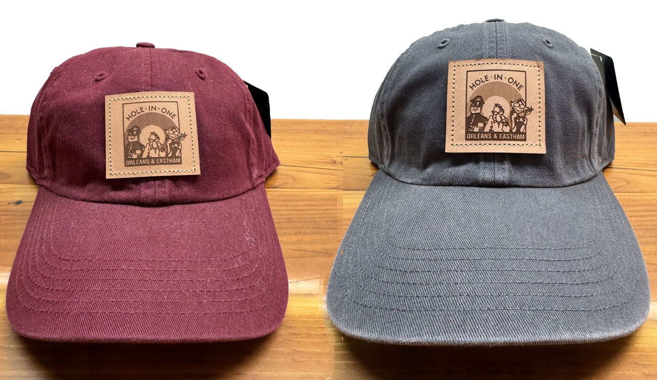 Our Hole in One baseball caps feature a classic curved brim and come in maroon and navy